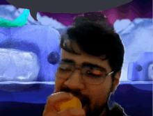 a man with glasses and a beard is eating an apple