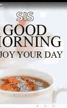 a cup of coffee with a message that says `` sis good morning joy your day ''