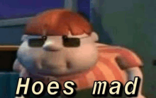 a cartoon character wearing sunglasses is sitting on a couch and says `` hoes mad '' .