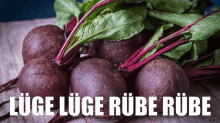 a bunch of beets on a wooden table with the words luge luge rube rube written below them