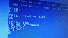 a commodore 64 basic v2 screen that says ready load press play on tape and searching found mittwoch loading ready