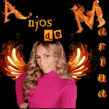 a woman in a pink sweater stands in front of a sign that says anjos de k