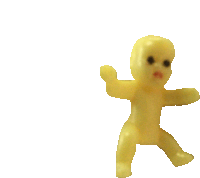 a small yellow doll with black eyes and a white background