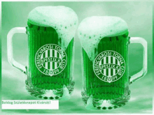 two green mugs of beer with the ferencvarosi torna club logo on them