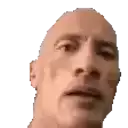 a close up of a bald man 's face with a serious look on his face on a white background .