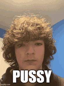 a young man with curly hair has the word pussy above his face