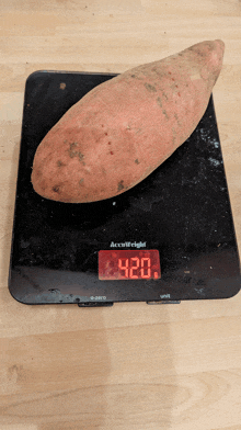 a large sweet potato on a accuweight scale