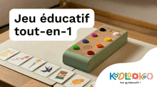 a game called jeu educatif tout-en-1 is being played on a table