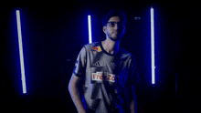 a man wearing glasses and a shirt with red bull on it