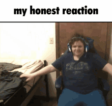 a man wearing headphones is sitting in a chair with his arms outstretched and the words " my honest reaction " above him