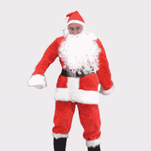 a man dressed as santa claus with a white beard and glasses