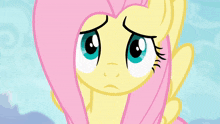 a close up of a cartoon pony 's face with a very angry expression