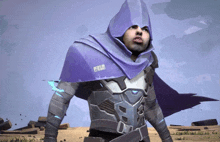 a man wearing a purple hooded cape has a sticker on his chest that says ' peace ' on it