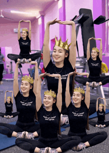 a group of girls wearing crowns and shirts that say " strong " on them