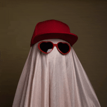 a ghost is wearing a red hat and sunglasses