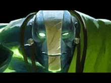 a close up of a video game character 's face with glowing green eyes .