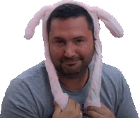 a man is wearing a pink bunny hat with moving ears