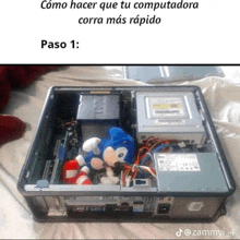 a picture of a dell computer with a stuffed sonic in it