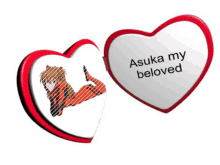 two red hearts with a picture of a girl and the words " asuka my beloved "