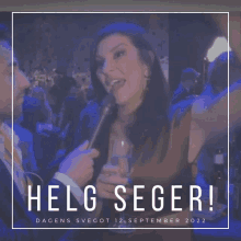 a woman is being interviewed by a man and the words helg seger are on the bottom of the image