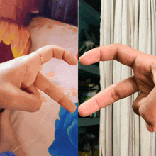 a close up of a person 's hand making a heart with their fingers