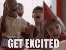 a group of children wearing party hats are standing in front of a cake with the words `` get excited '' written on it .