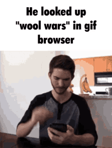 a man is looking up " wool wars " in a gif browser on his phone