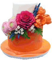 an orange cake with pink roses and orange tulips on top