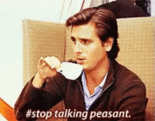 a man drinking a cup of coffee with the words #stop talking peasant behind him