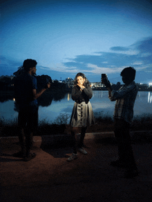 a man taking a picture of a woman with a camera