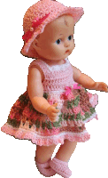 a doll wearing a pink hat and a pink dress