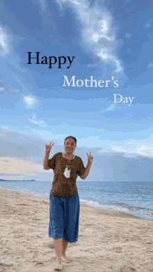 a woman standing on a beach with the words happy mother 's day