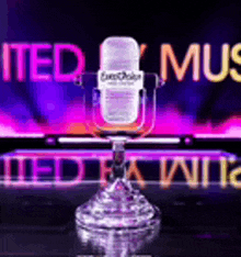 a microphone is sitting in front of a sign that says " united music "