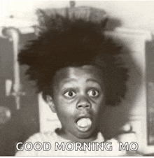 a black and white photo of a girl with a surprised look on her face and the words good morning mo written below her