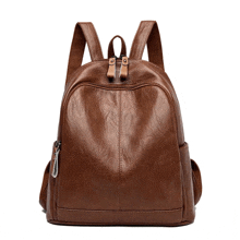 a brown leather backpack with a zipper on it