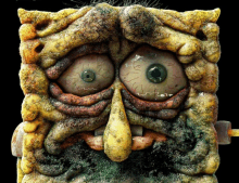 a close up of a spongebob cartoon character with a very ugly face