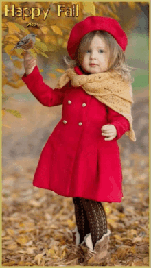 a little girl in a red coat is holding a small bird in her hand with the words happy fall written above her