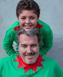 a man and a boy are posing for a picture together