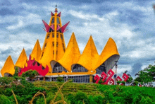 a large yellow and red building with a tower on top of it .