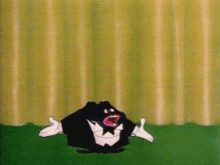 a cartoon character wearing a tuxedo and bow tie is standing in front of a curtain .