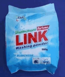 a bag of link washing powder on a blue surface