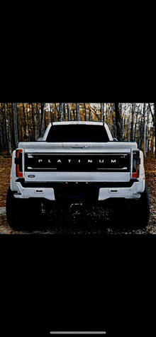 a white truck with the word platinum on the back of it