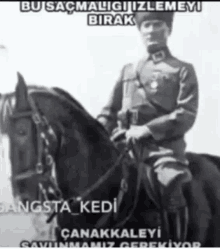 a black and white photo of a man riding a horse with a caption that says " bu saçmaliği izlemeyi birak "