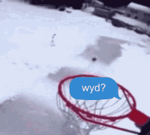 a basketball hoop in the snow with a blue speech bubble that says " wyd "