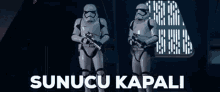 two stormtroopers are standing next to each other in front of a window with the words sunucu kapali on the bottom .