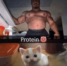 a muscular man is standing next to a small kitten in a refrigerator .