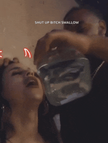 a man is pouring water into a woman 's mouth with the words shut up bitch swallow above it