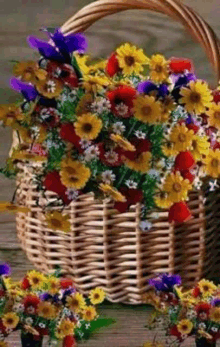 a wicker basket filled with colorful flowers on a table