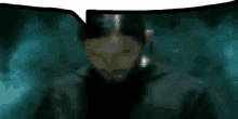 a blurred image of a man with a beard