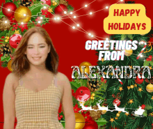 a christmas greeting from alexandra with a woman in front of a christmas tree